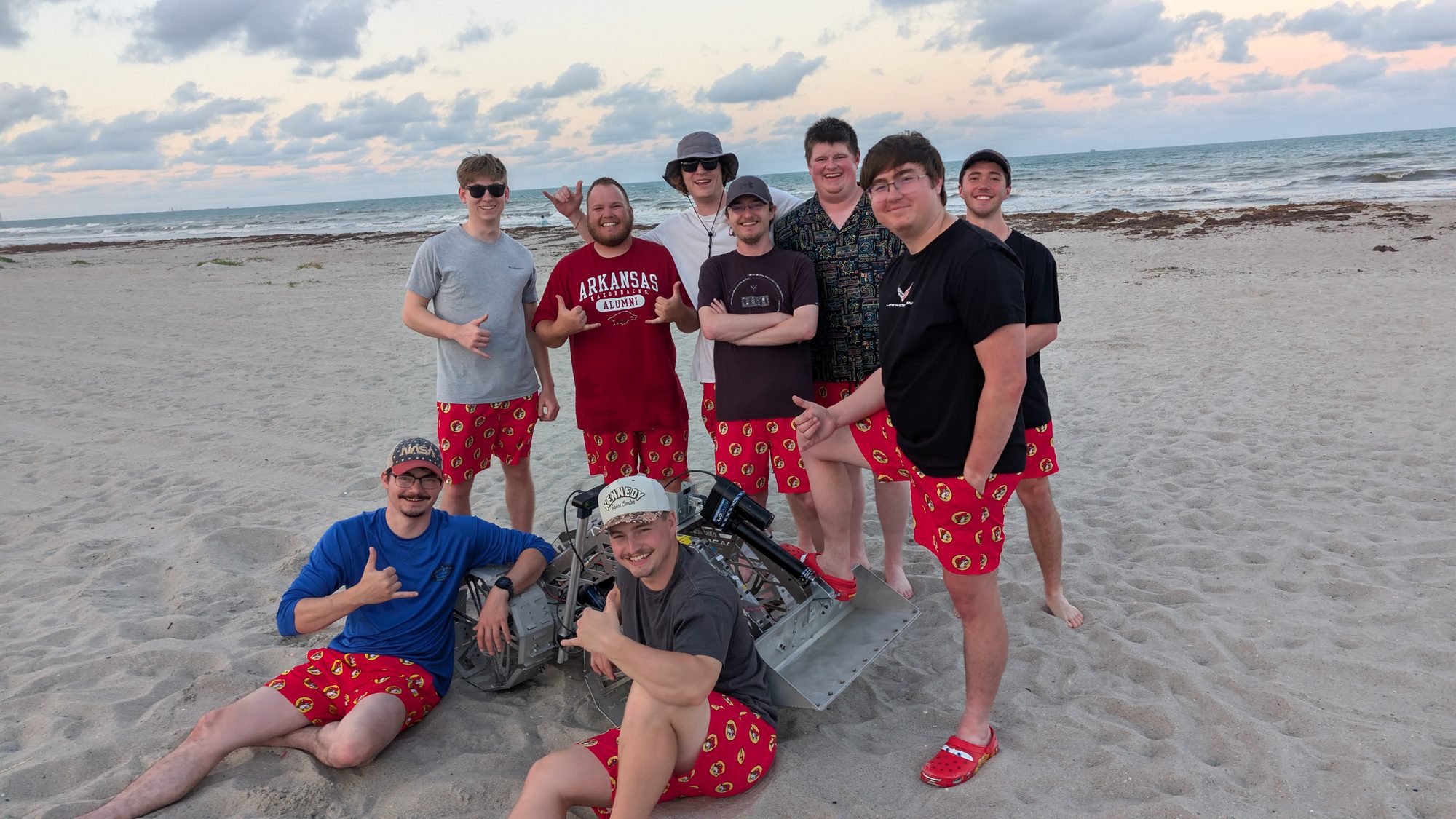 2026 team with robot on the beach